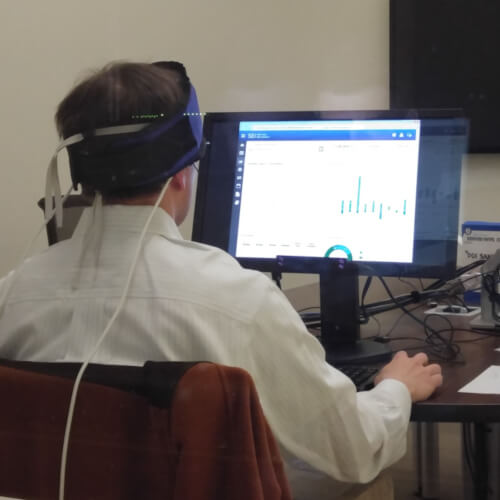 Participant doing tests in a lab measuring brain activity