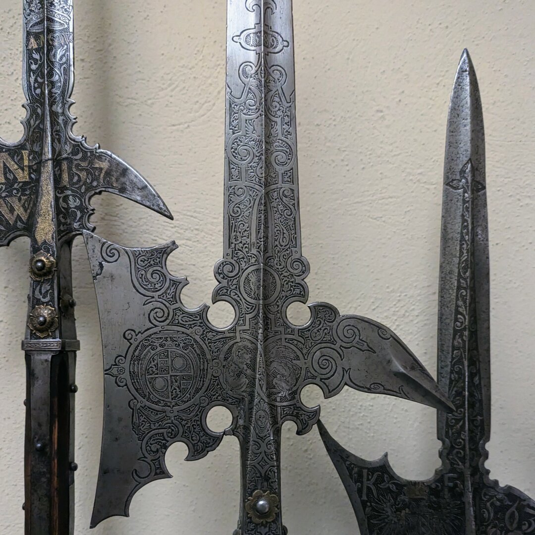 The silver blades of some medieval axes, I think, with intricate carved patterns on them
