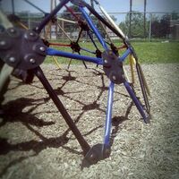 A metal jungle gym at the playground