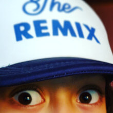 my daughter wearing a hat that says 'the Remix'
