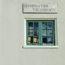 a small window with an 'information technology' sign above it